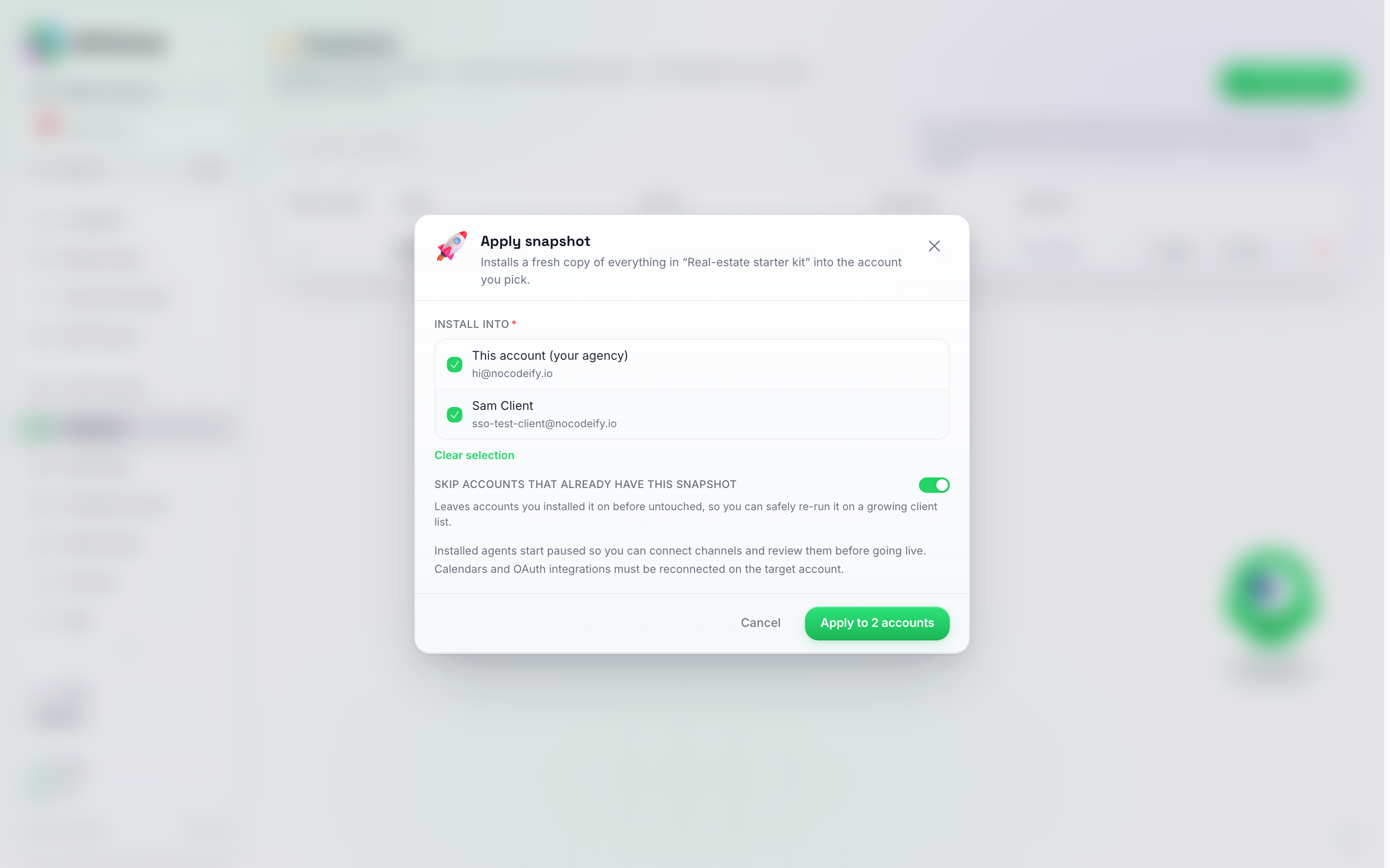 The Apply snapshot window with the Install into list showing the agency account and one client account both ticked, the Skip accounts that already have this snapshot switch on, and an Apply to 2 accounts button