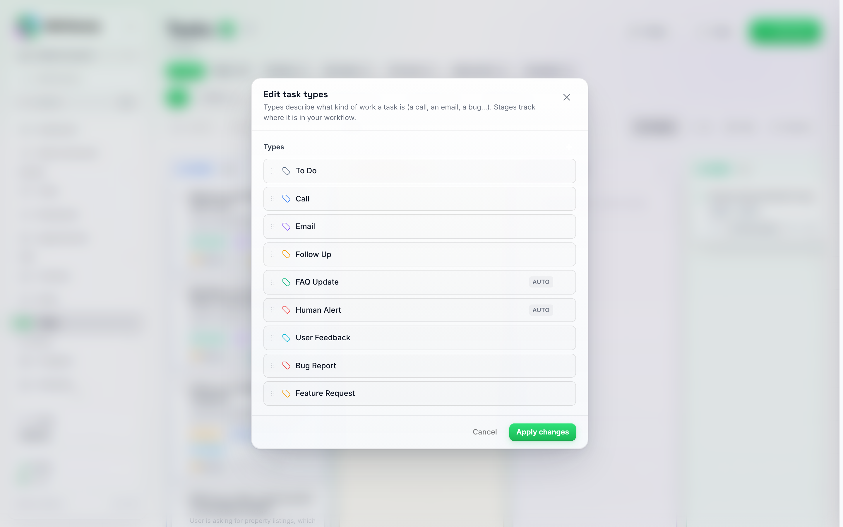 El cuadro de diálogo Editar tipos de tarea que enumera cada tipo con su icono de etiqueta de color, una insignia de Auto en Actualización de preguntas frecuentes y Alerta humana, un + para añadir un tipo y botones de Cancelar / Aplicar cambios